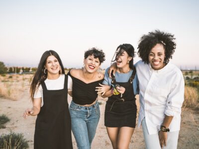 Smiling women posing in countryside