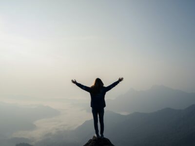 Young traveler standing and looking at beautiful landscape